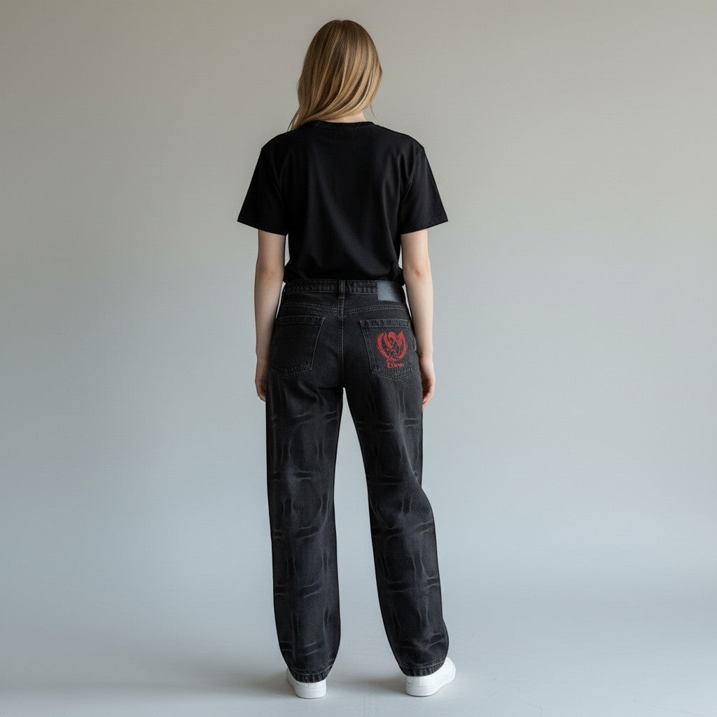Vallmountbotique black denim straight leg jeans with embossed pattern and red graphic on back pocket.