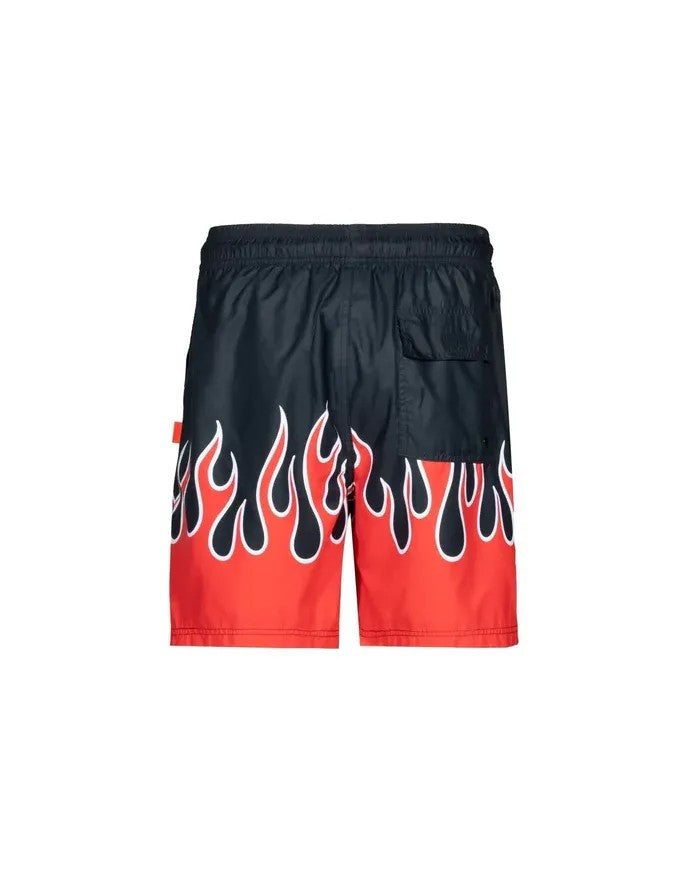 Vallmountbotique black swim trunks with red flame print and elastic waistband.