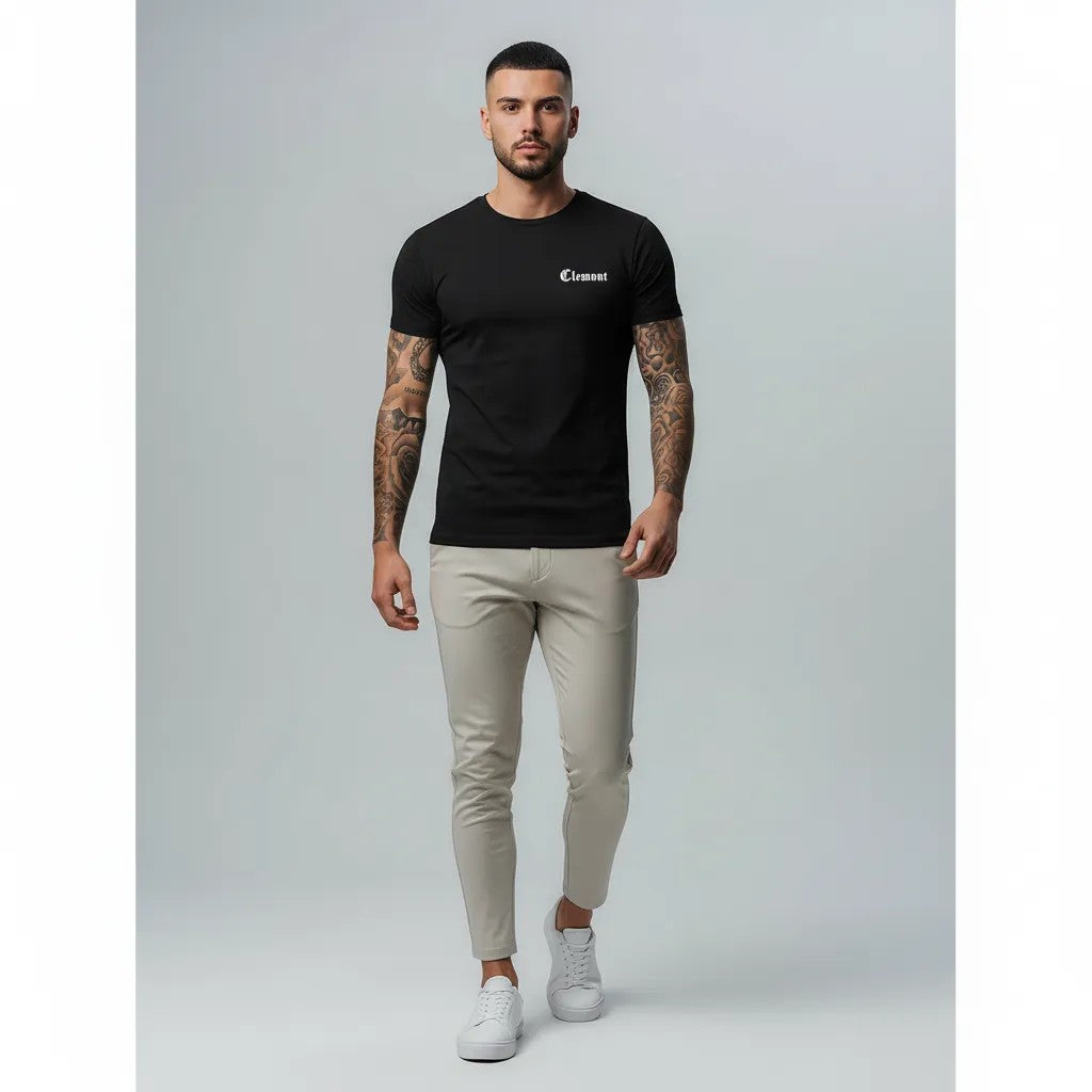 Vallmountbotique black cotton t-shirt with subtle chest branding and graphic rose design on back.