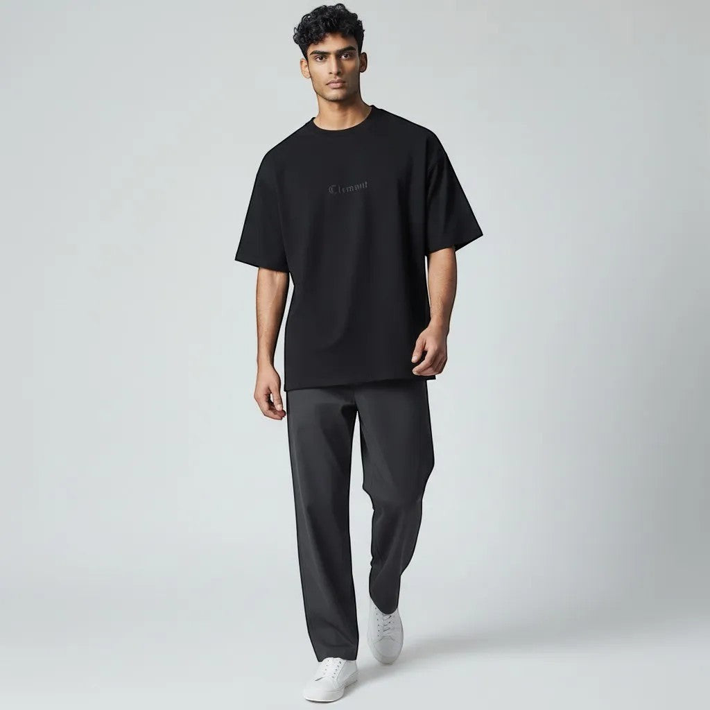Vallmountbotique black oversized cotton t-shirt with subtle Clement logo and graphic print.