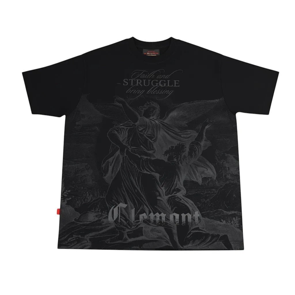 Vallmountbotique black oversized cotton t-shirt with a monochromatic graphic print of angels and the quote "Faith and Struggle Bring Blessing."