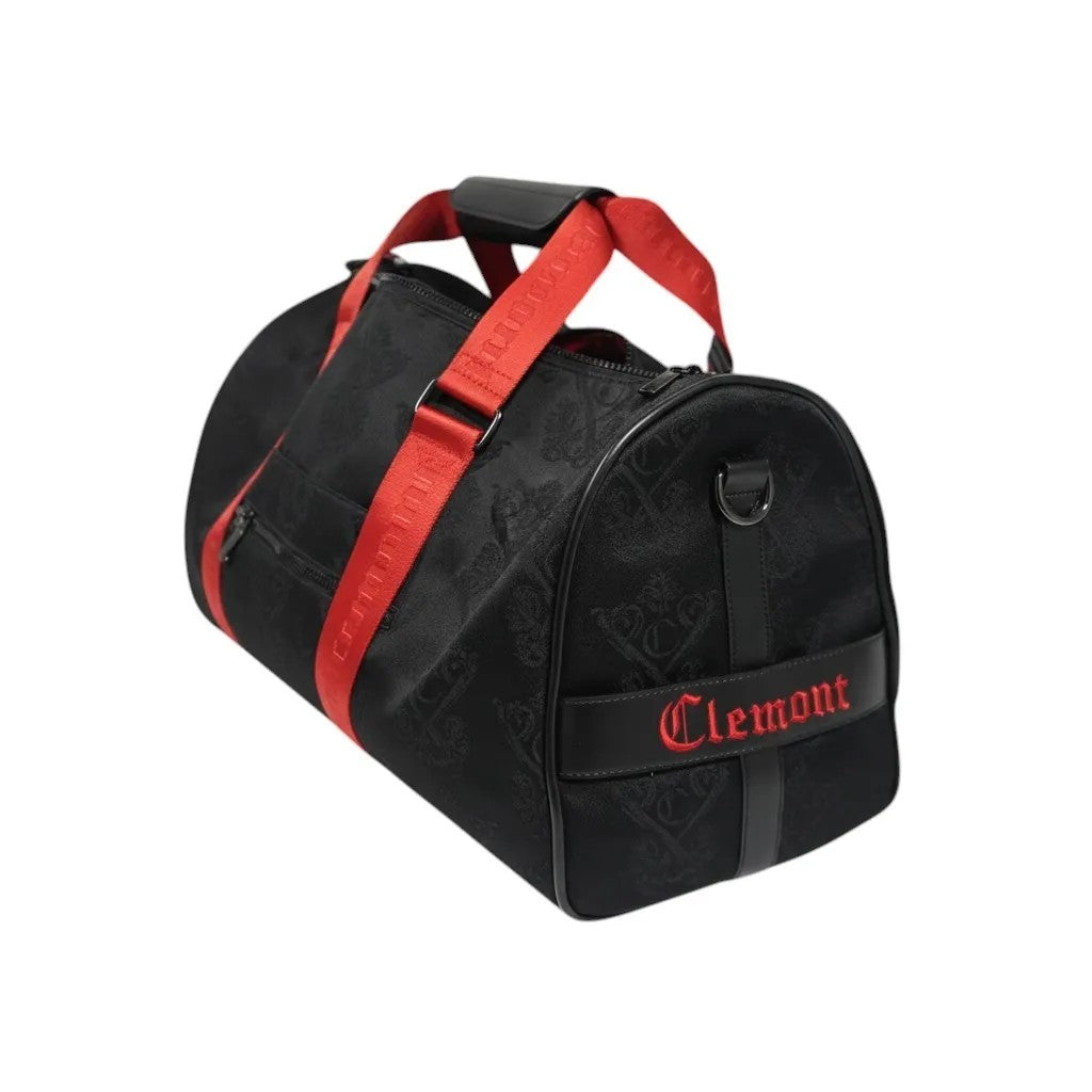 Vallmountbotique black embossed monogram duffle bag with red straps and red 'Clemont' embroidery.