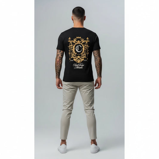 Vallmountbotique black cotton t-shirt with ornate gold crest graphic on back and chest, featuring