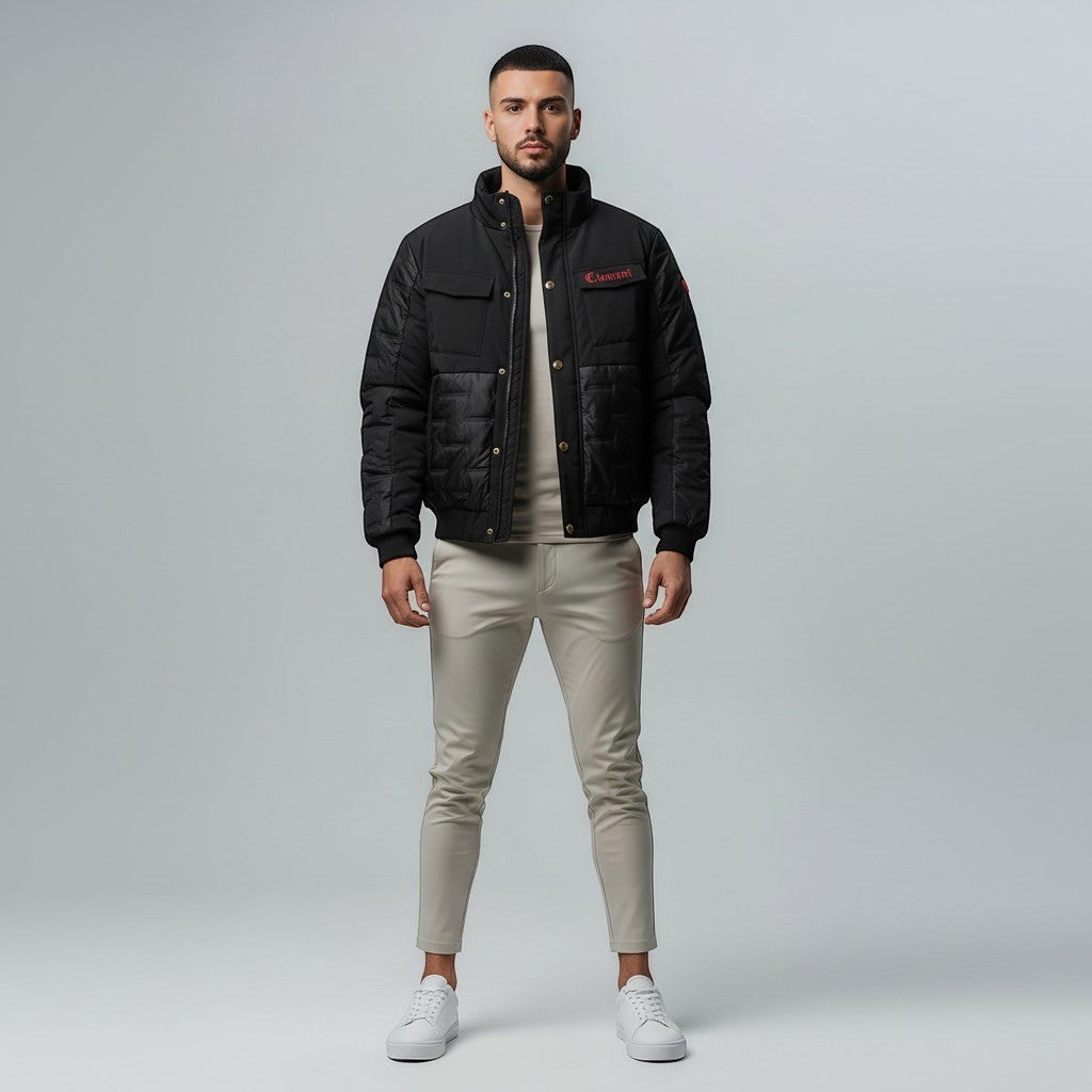 Vallmountbotique black padded bomber jacket with quilted paneling, ribbed cuffs, collar, and hem, and zip-up front.