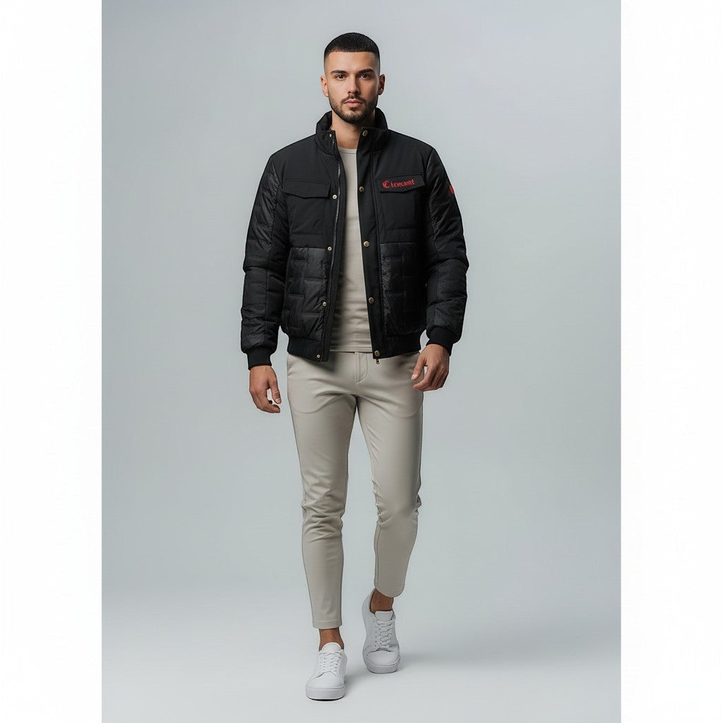 Vallmountbotique black padded bomber jacket with quilted paneling, ribbed cuffs, collar, and hem. Features zip-up front and subtle logo detail.