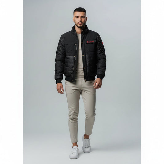 Vallmountbotique black padded bomber jacket with quilted paneling, ribbed cuffs, collar, and hem. Features zip-up front and subtle logo detail.