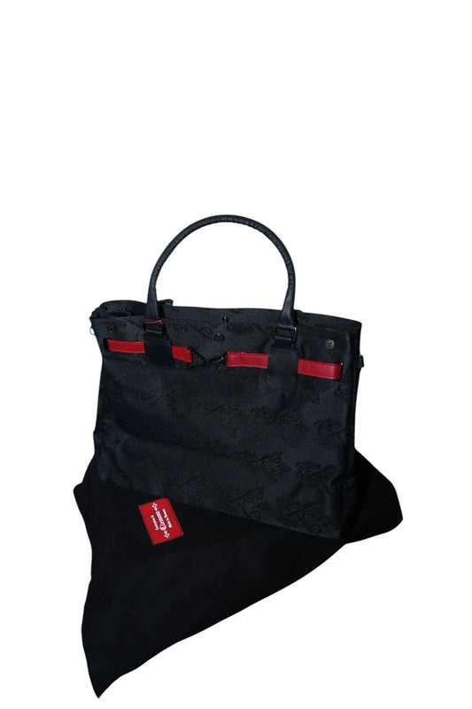 Vallmountbotique Vivienne Westwood black tote bag with red accents and embossed pattern. Features leather handles and a spacious interior.