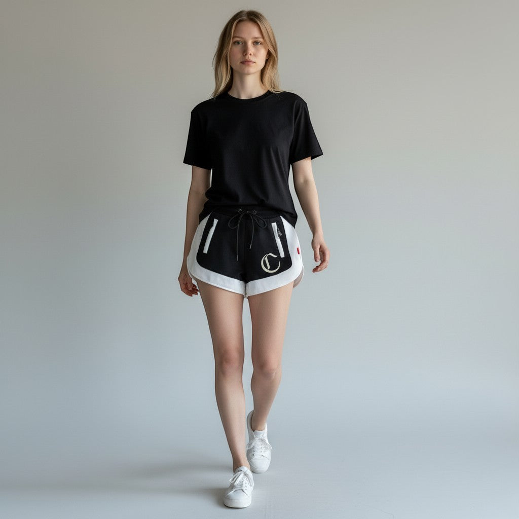 Vallmountbotique black and white athletic shorts with drawstring waist and embroidered logo detail.