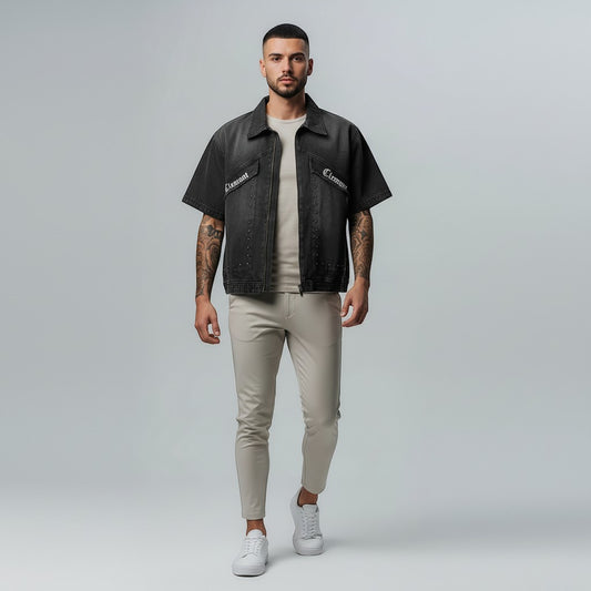 Vallmountbotique charcoal wash denim work shirt with short sleeves and zip front, worn by a man with tattoos.