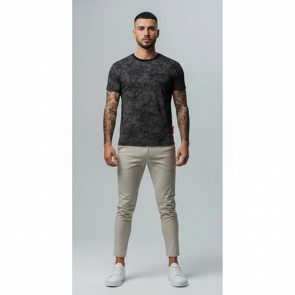 Vallmountbotique dark grey marble print crew neck t-shirt with short sleeves worn by a man.