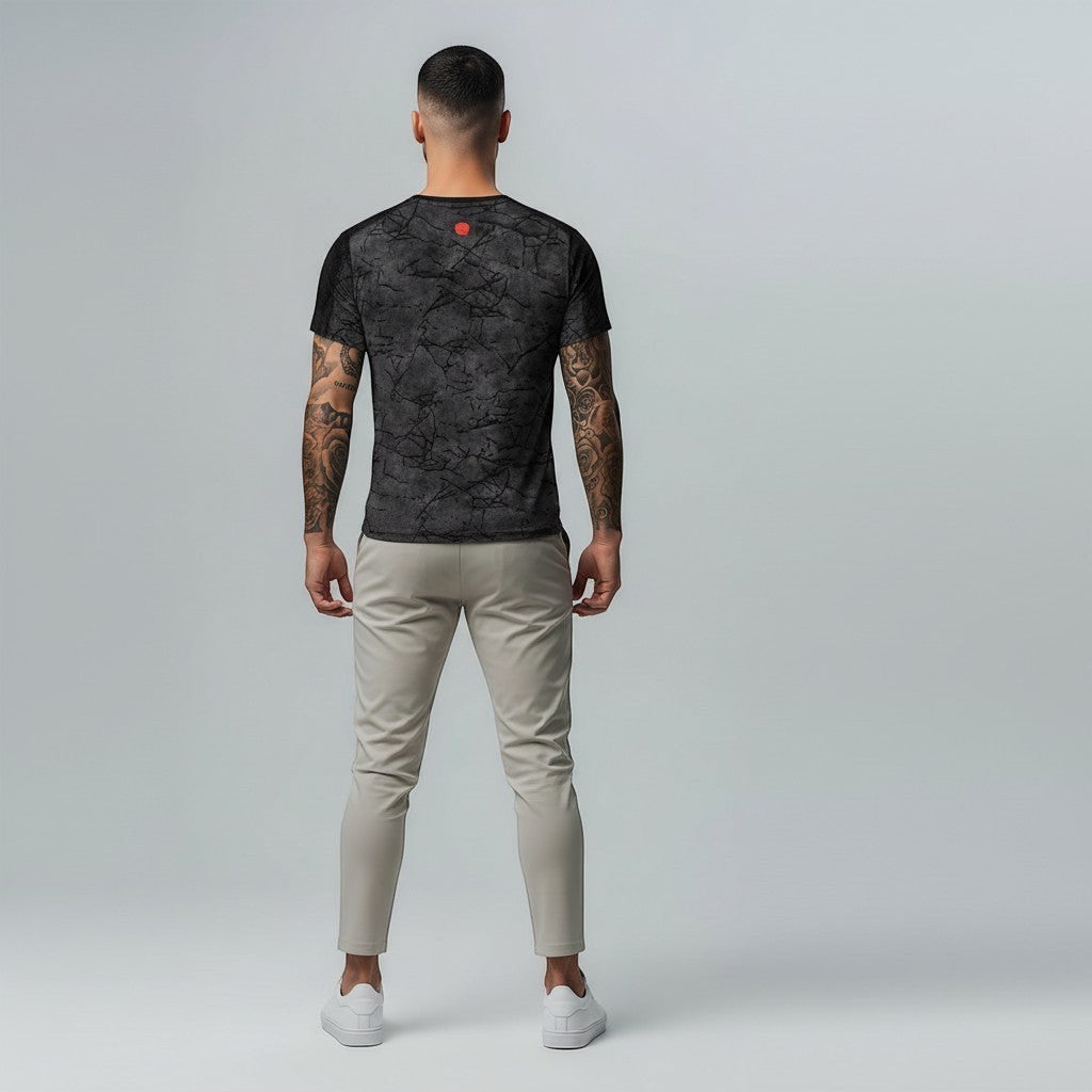 vallmountbotique dark grey marble print crew neck t-shirt with short sleeves on a tattooed man.