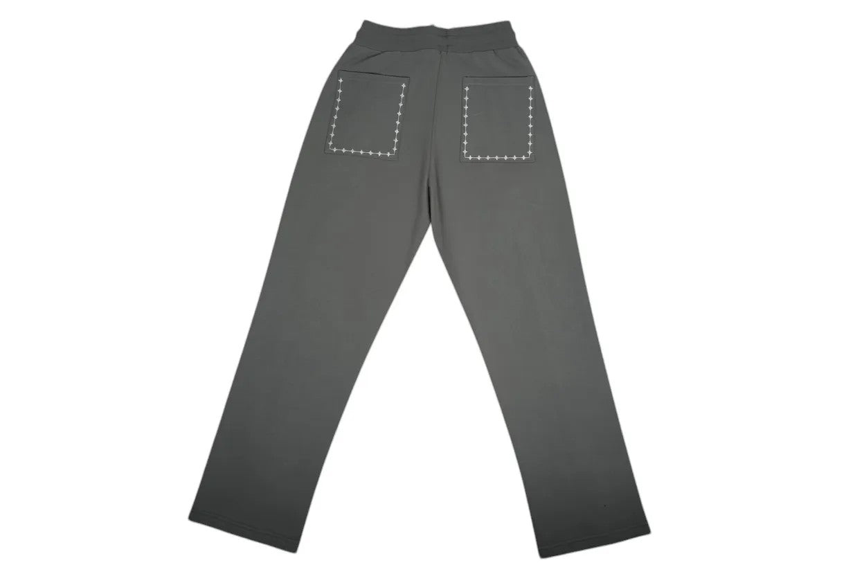 Vallmountbotique grey sweatpants with drawstring waist, two side pockets, and decorative back pockets with cross-stitch detail.