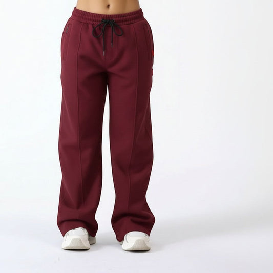Vallmountbotique maroon wide leg track pants with drawstring waist and zippered ankles.