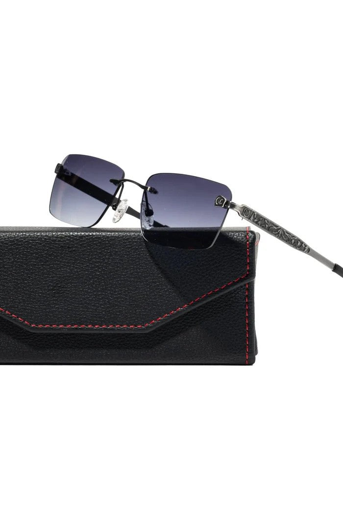 Vallmountbotique rimless gradient lens sunglasses with ornate silver temples and black leather case with red stitching.