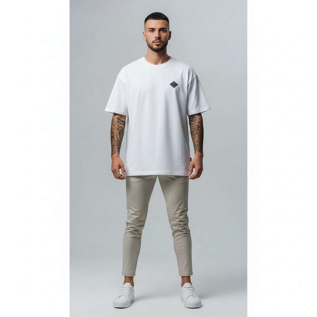 Vallmountbotique white oversized cotton t-shirt with crew neck and embroidered diamond logo on chest.